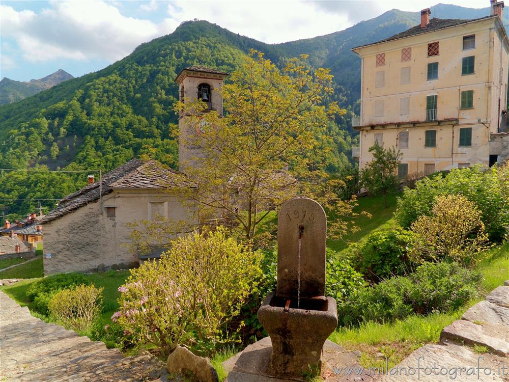Montesinaro fraction of Piedicavallo (Biella, Italy) - A view with church and fountain